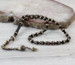 سبحة كوك اسود بشرابة فضية مطلية بالذهب