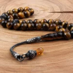 سبحة من حجر عين النمر فضة عيار 1000 قيراط مع شرابات قزاز